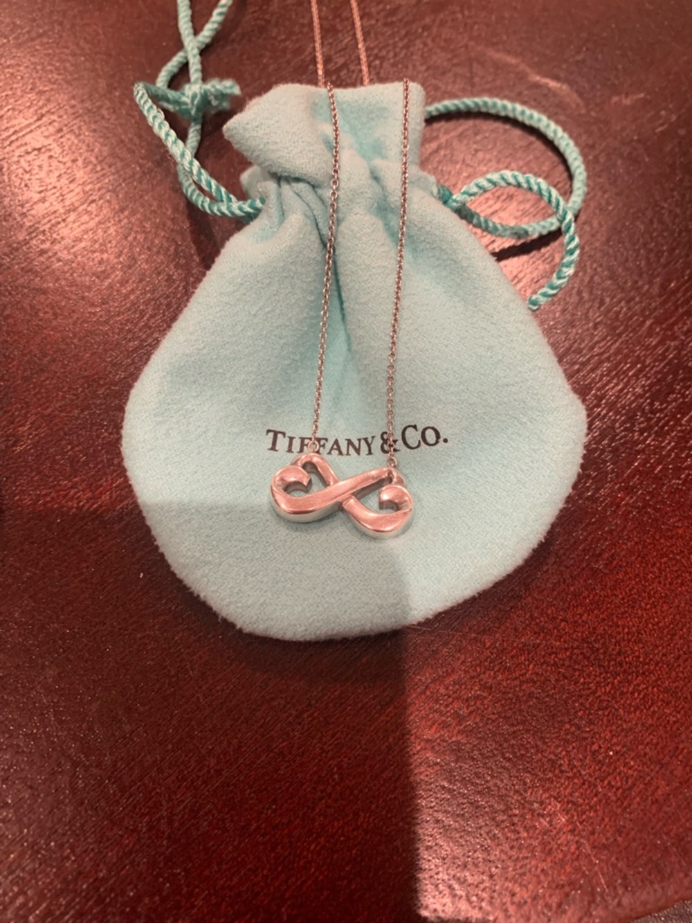 Tiffany & Co. Silver Infinity Heart Necklace with Blue Pouch